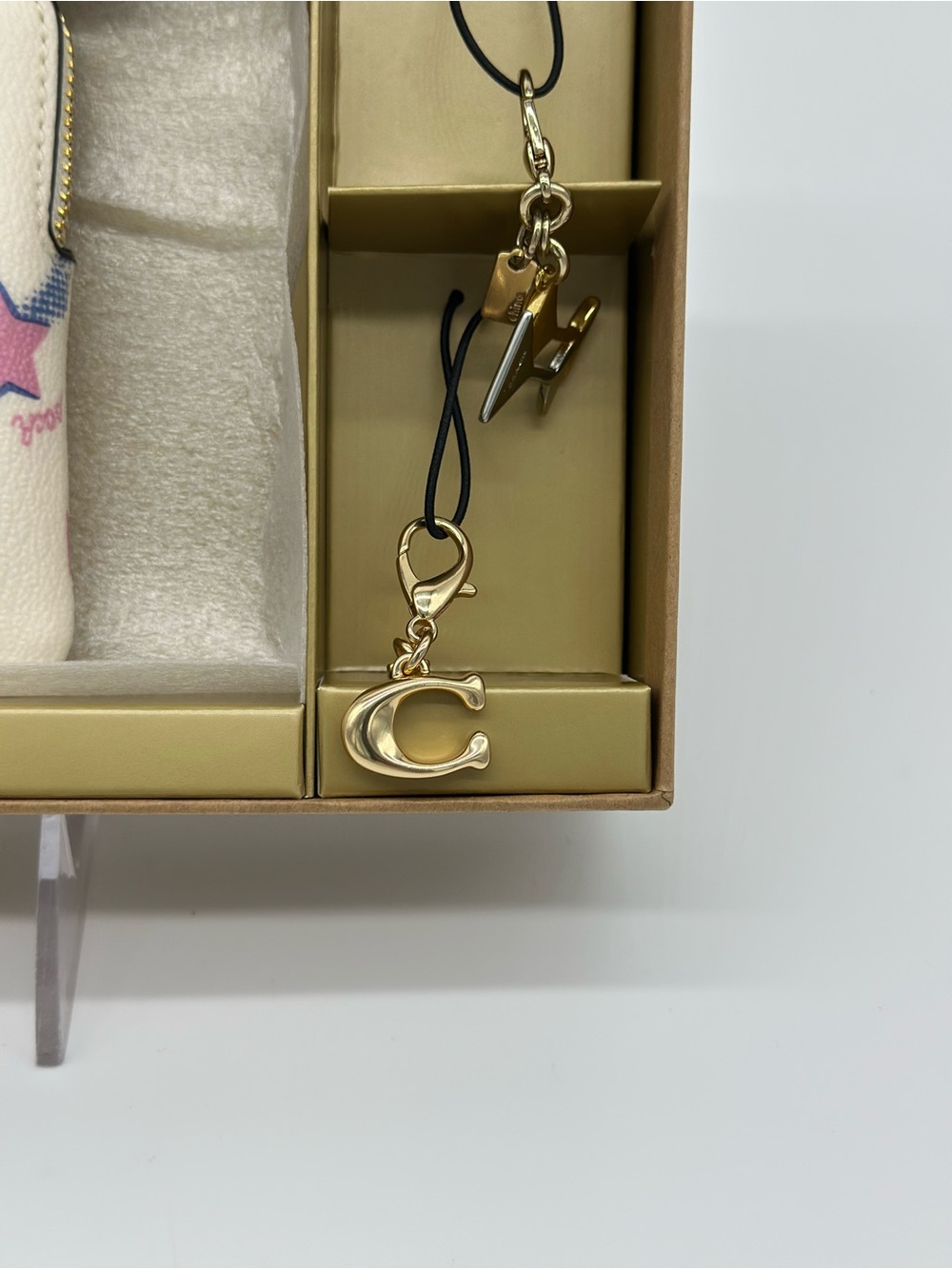 Coach White Wristlet with Pink Star Motif and Gold Charm - Picture 2 of 7